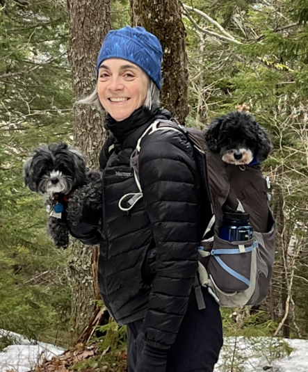 Catherine DesRoches, DrPH, with dogs.