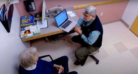 Peter Elias, MD, meets with his patient to talk about open notes.
